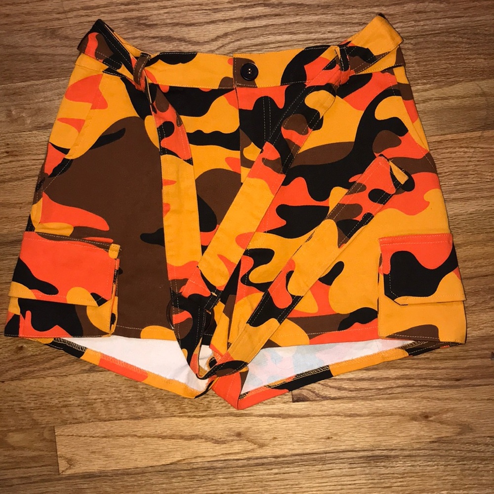 I am selling orange camo high-waist shorts.